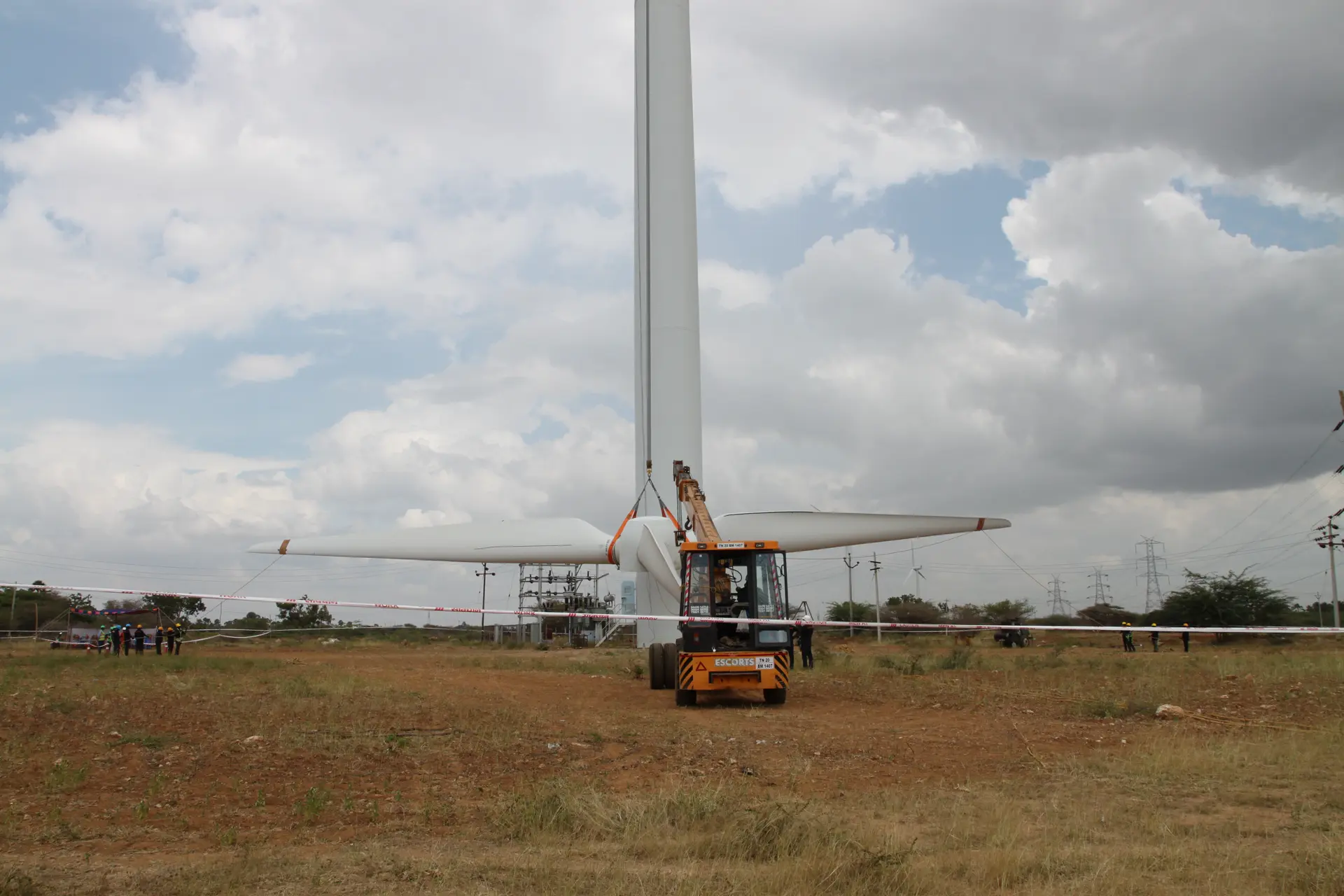 A vast wind power landscape showcasing high-tech turbines across a clean, green horizon.